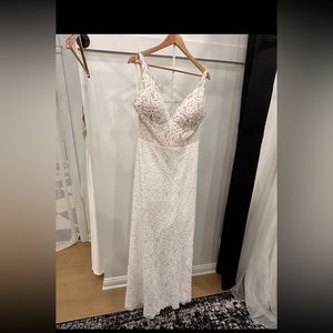 Never been worn or altered dress! Mikaella Bridal dress winter 2023.
Size 14